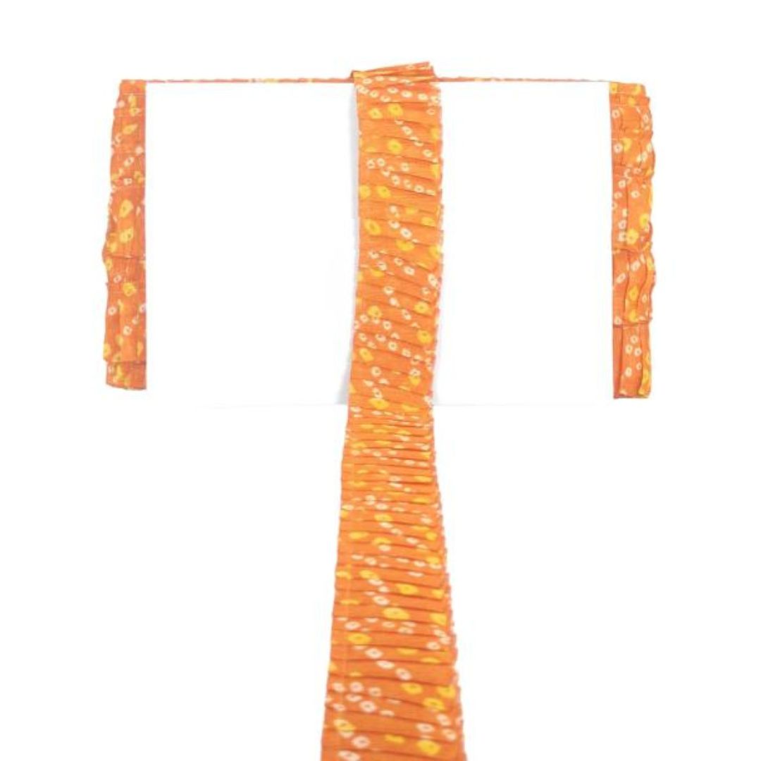 Orange fabric with yellow patterns on a white background